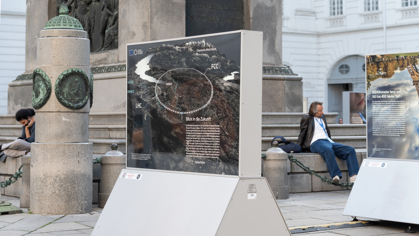 An information board showing plans for the FCC, part of the Code of the Universe exhibit, displayed during FCC Week 2025 in Vienna, Austria. Credit: Joseph Krpelan, Michael Gizicki / CERN